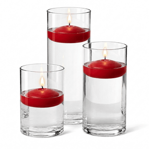 13 of 14: Cylinder Vase Centerpiece & Richland 3" Floating Candles Set of 12
